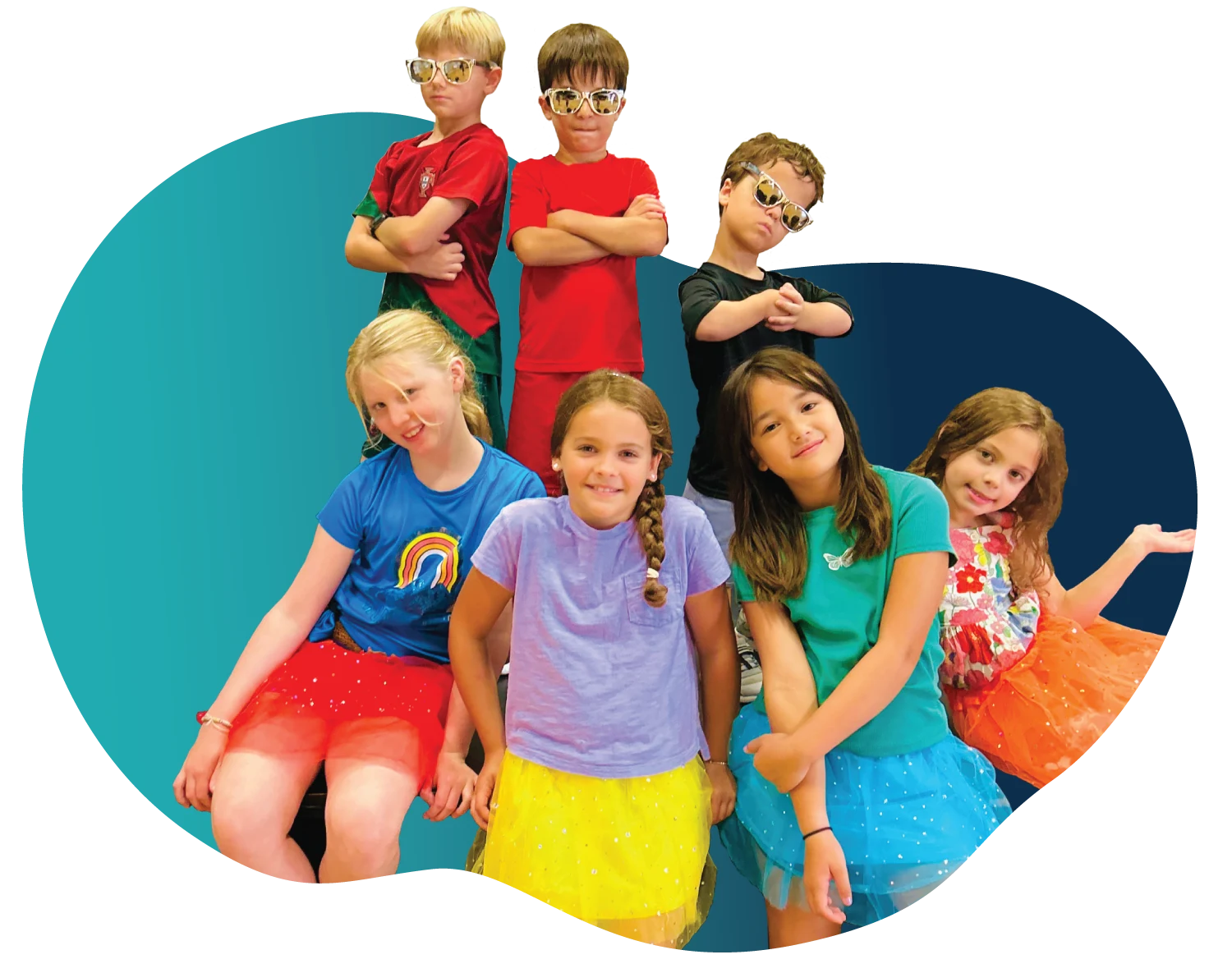Student Spotlight - WonderStage Joy A smiling young girl holding soft pink poms during preschool music lessons at FAME Performing Arts in Mount Pleasant.