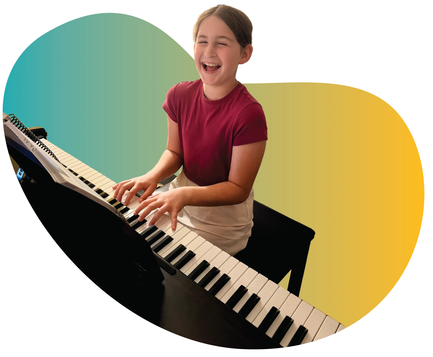 Student Spotlight - WonderStage Joy A smiling young girl holding soft pink poms during preschool music lessons at FAME Performing Arts in Mount Pleasant.