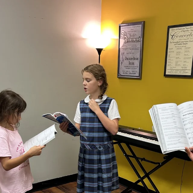 Service - Private Singing Lessons A young student practicing vocal techniques during a private singing lesson at our Mount Pleasant studio.