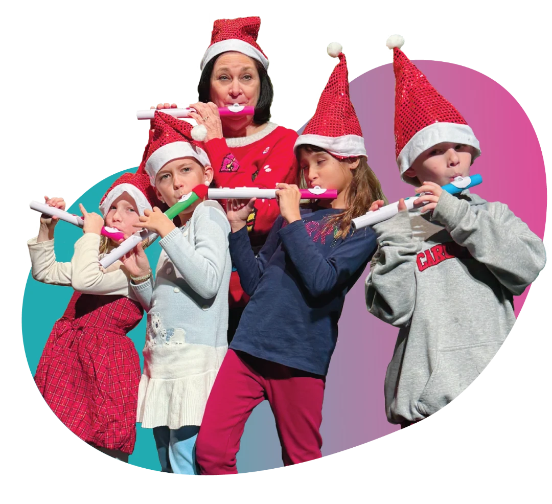 elf-group-flute Young girl playing the flute during a private lesson at FAME Performing Arts.