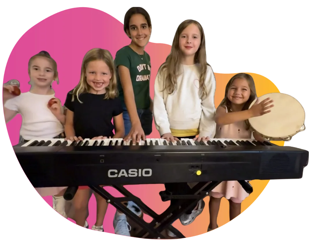 Student Spotlight - WonderStage Joy A smiling young girl holding soft pink poms during preschool music lessons at FAME Performing Arts in Mount Pleasant.
