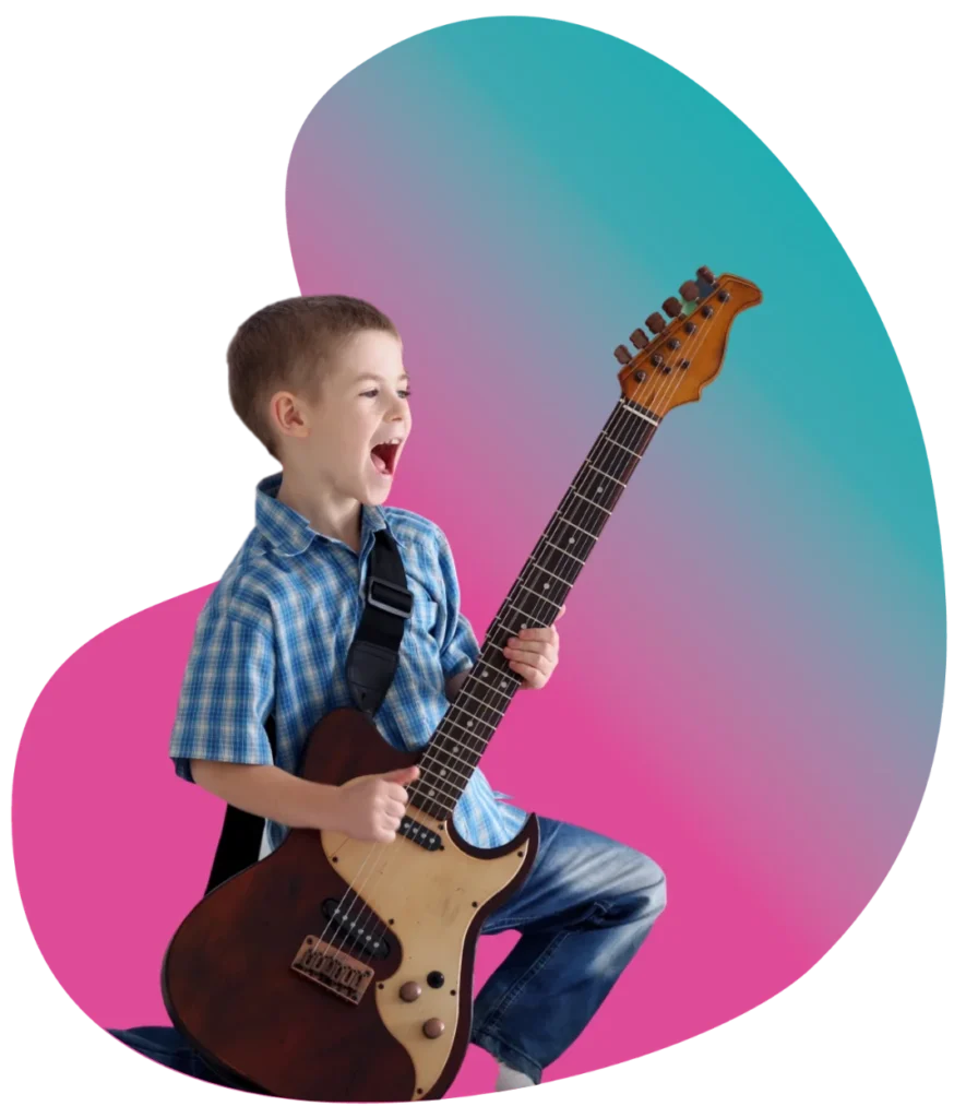 Excited young boy wearing a plaid shirt enthusiastically playing an electric guitar during a kids private guitar lesson.