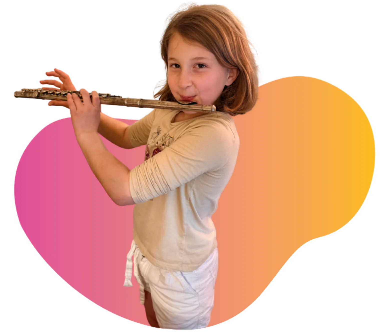Student Spotlight - WonderStage Joy A smiling young girl holding soft pink poms during preschool music lessons at FAME Performing Arts in Mount Pleasant.